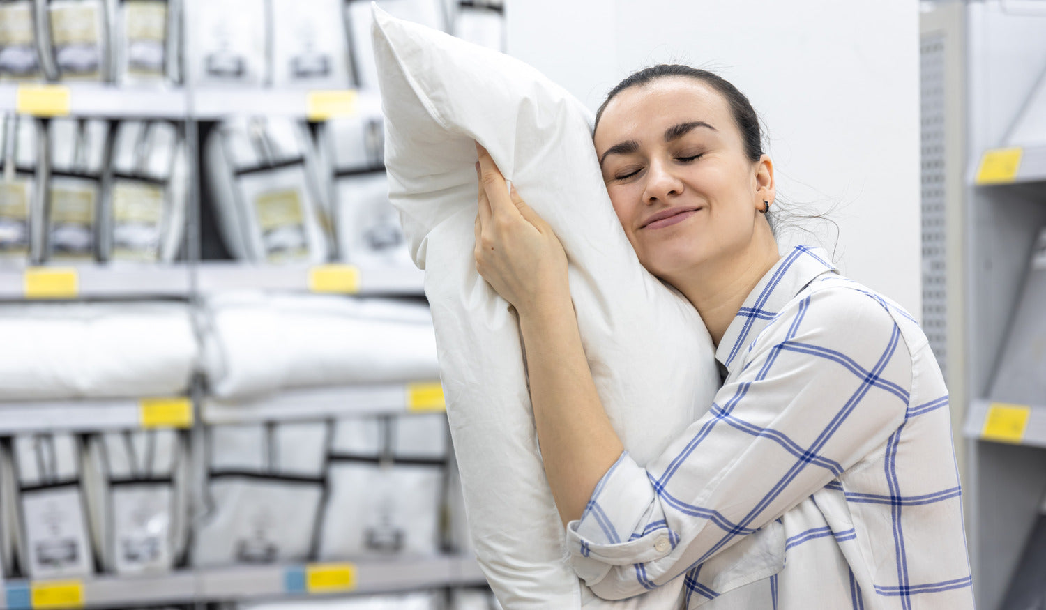 Women chooses a pillow in a store based in Cyprus